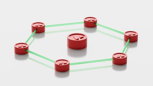 Avalanche (AVAX) cryptocurrency and blockchain, represented by physical coins.