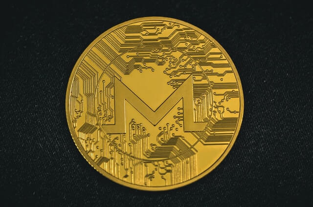 Monero cryptocurrency represented by gold physical XMR coin.